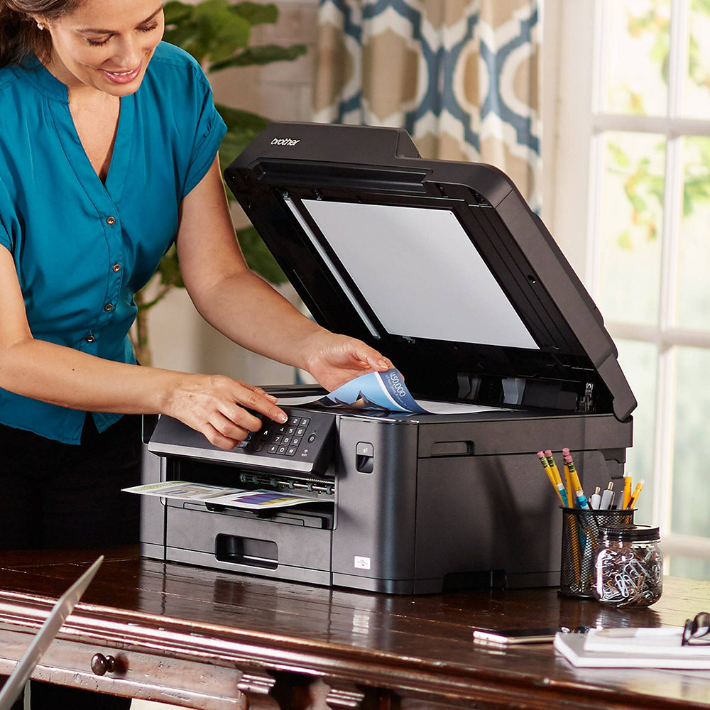 A woman using a printer scanner